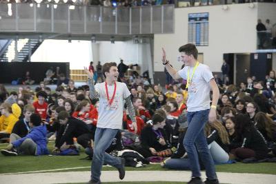 Science Olympians high-five during awards ceremony